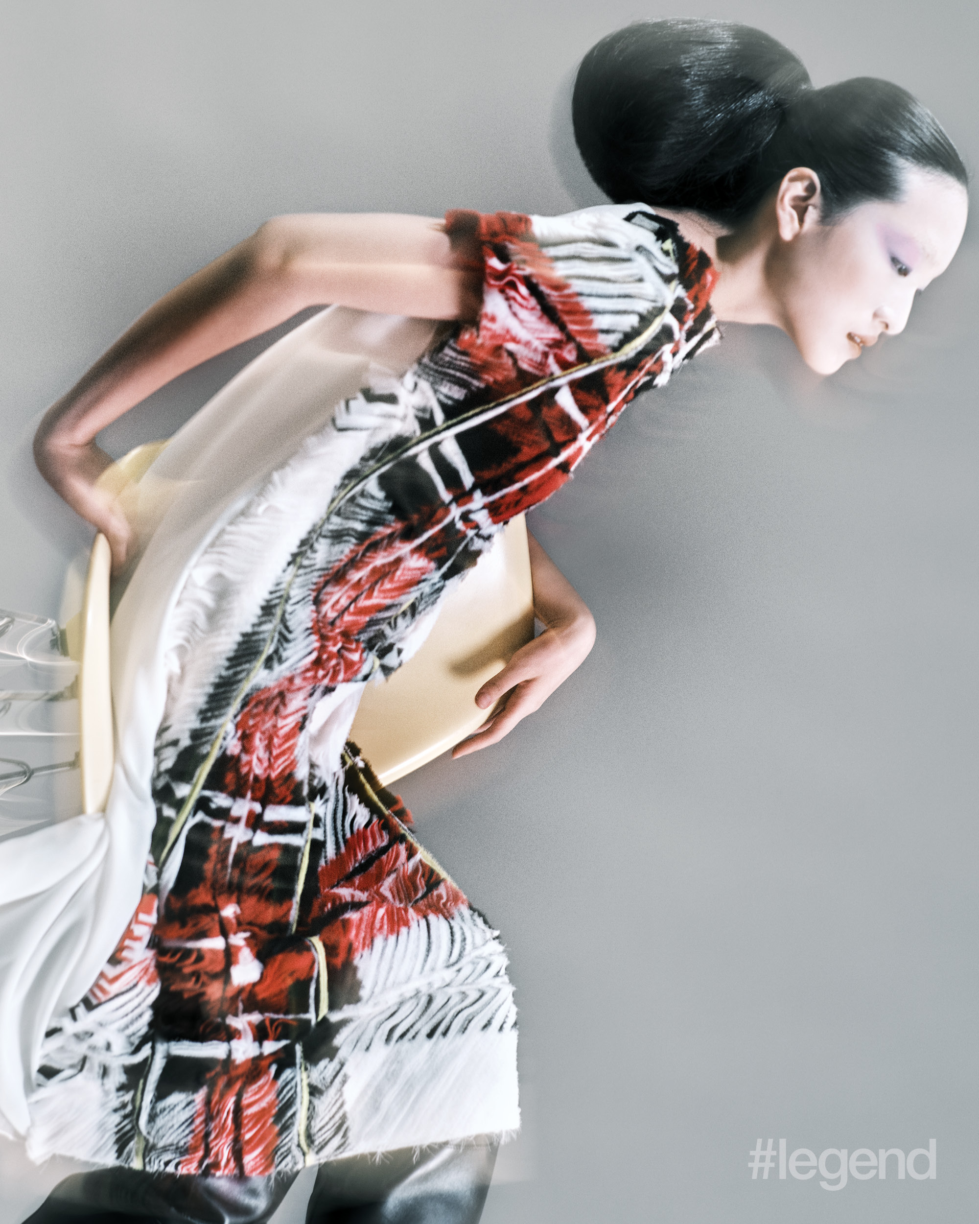 White dress with black and red fringe _ Loewe; Black boots _ Gucci