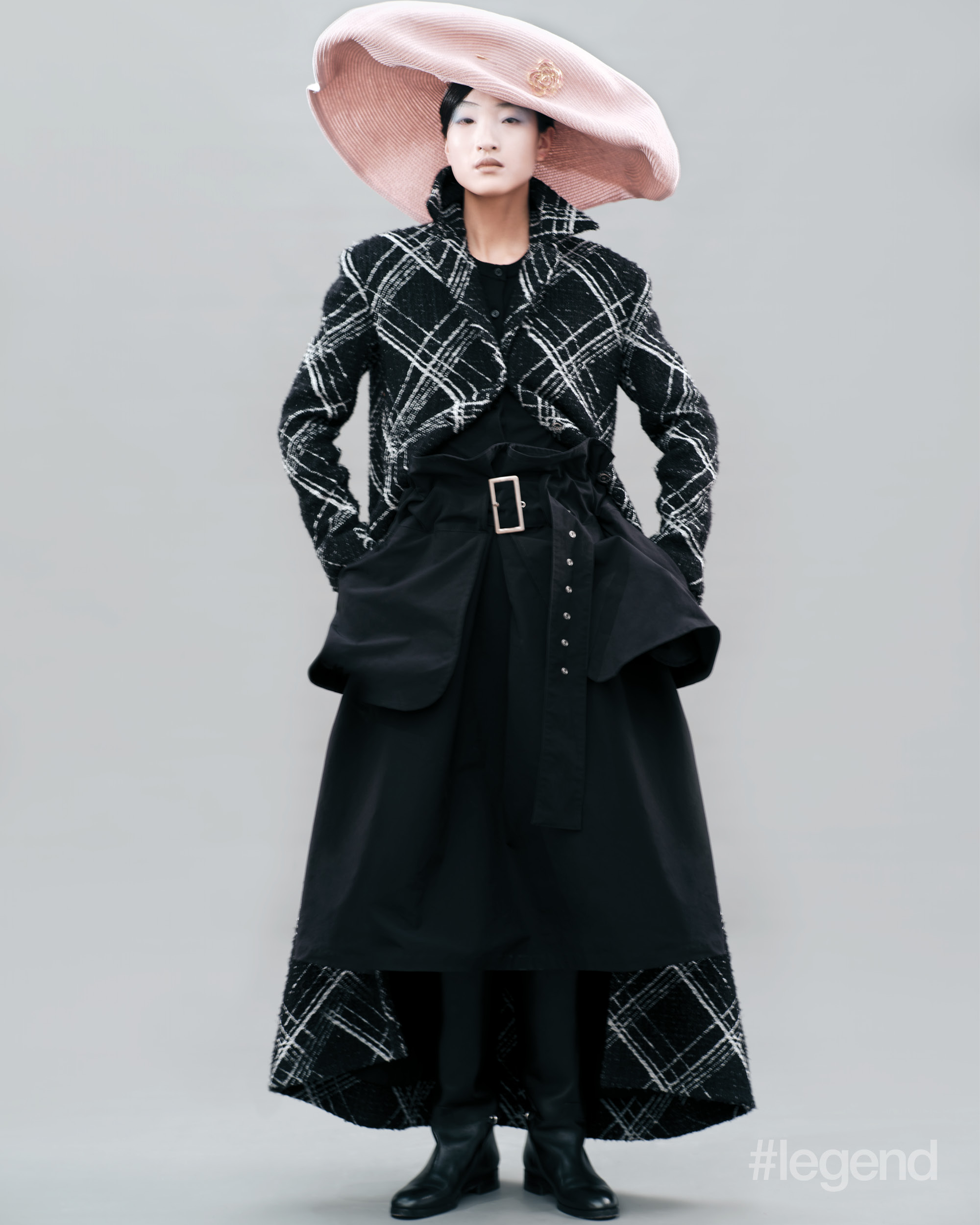 Black and white tweed coat, and pink hat _ Chanel; Black boots _ Gucci; (Stylist’s own skirt)