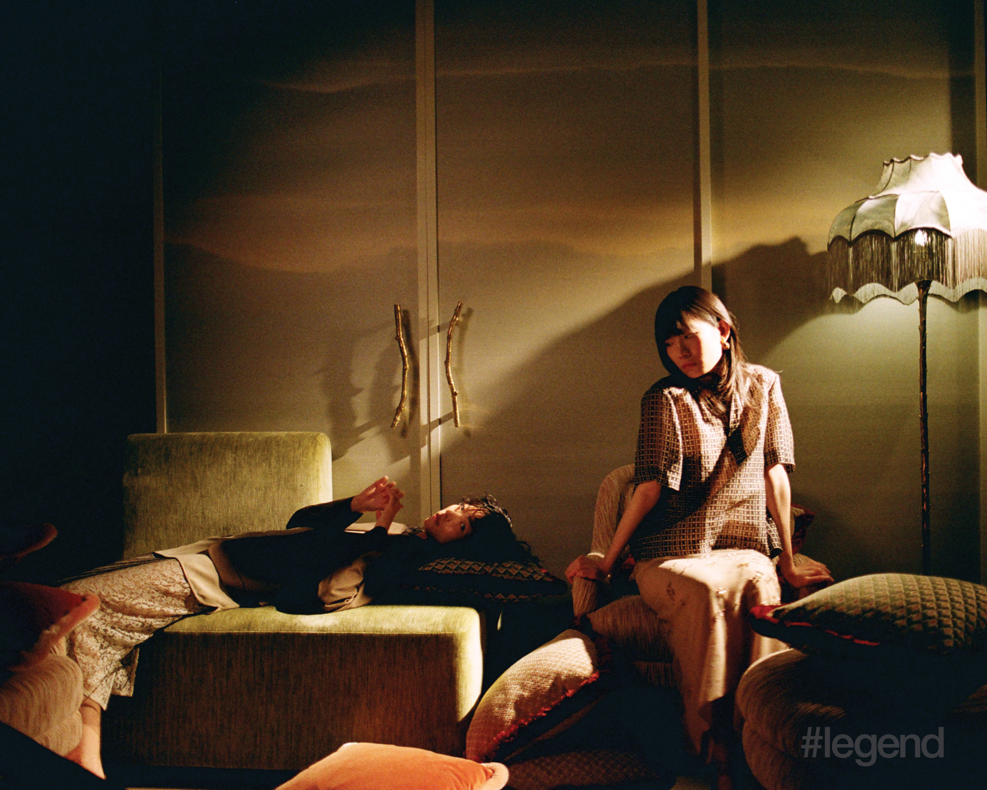 On Lu (left): Brown cardigan, and beige shirt and lace skirt _ Fendi On Cleo (right): Brown printed short-sleeve top, beige floral skirt and gold earrings _ Fendi