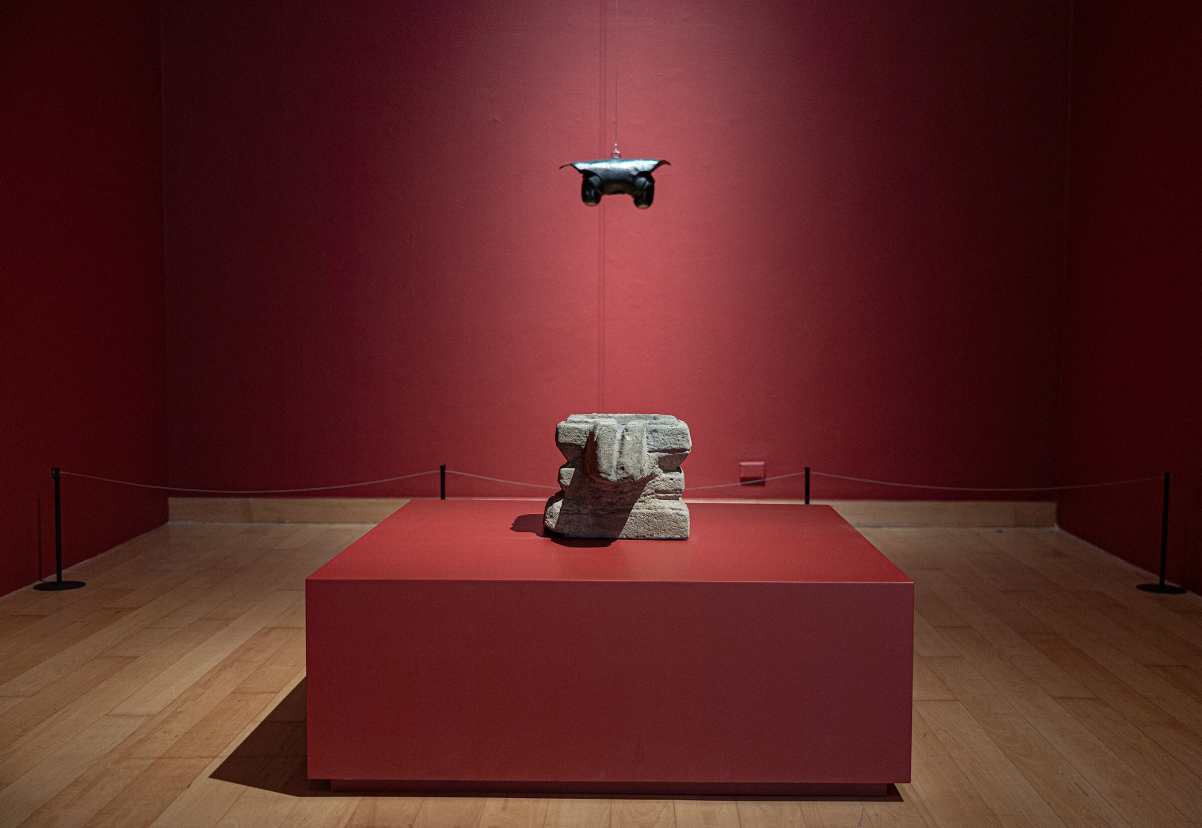 Louise Bourgeois’s Janus In Leather Jacket, 1968, installed with a Yoni sculpture from the Lopburi period, Khmer Empire