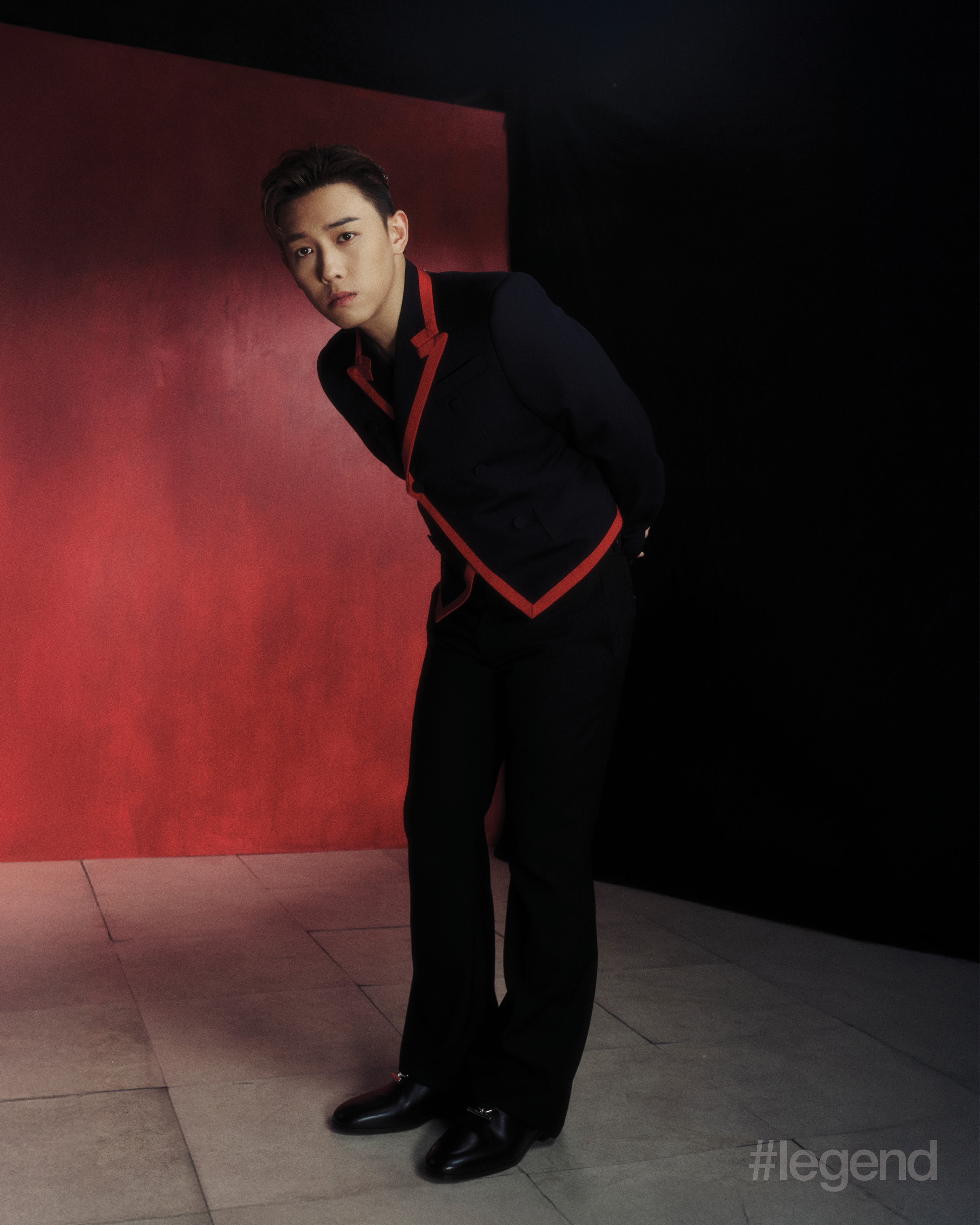 Navy jacket with red trim, flared trousers and leather shoes _ McQueen