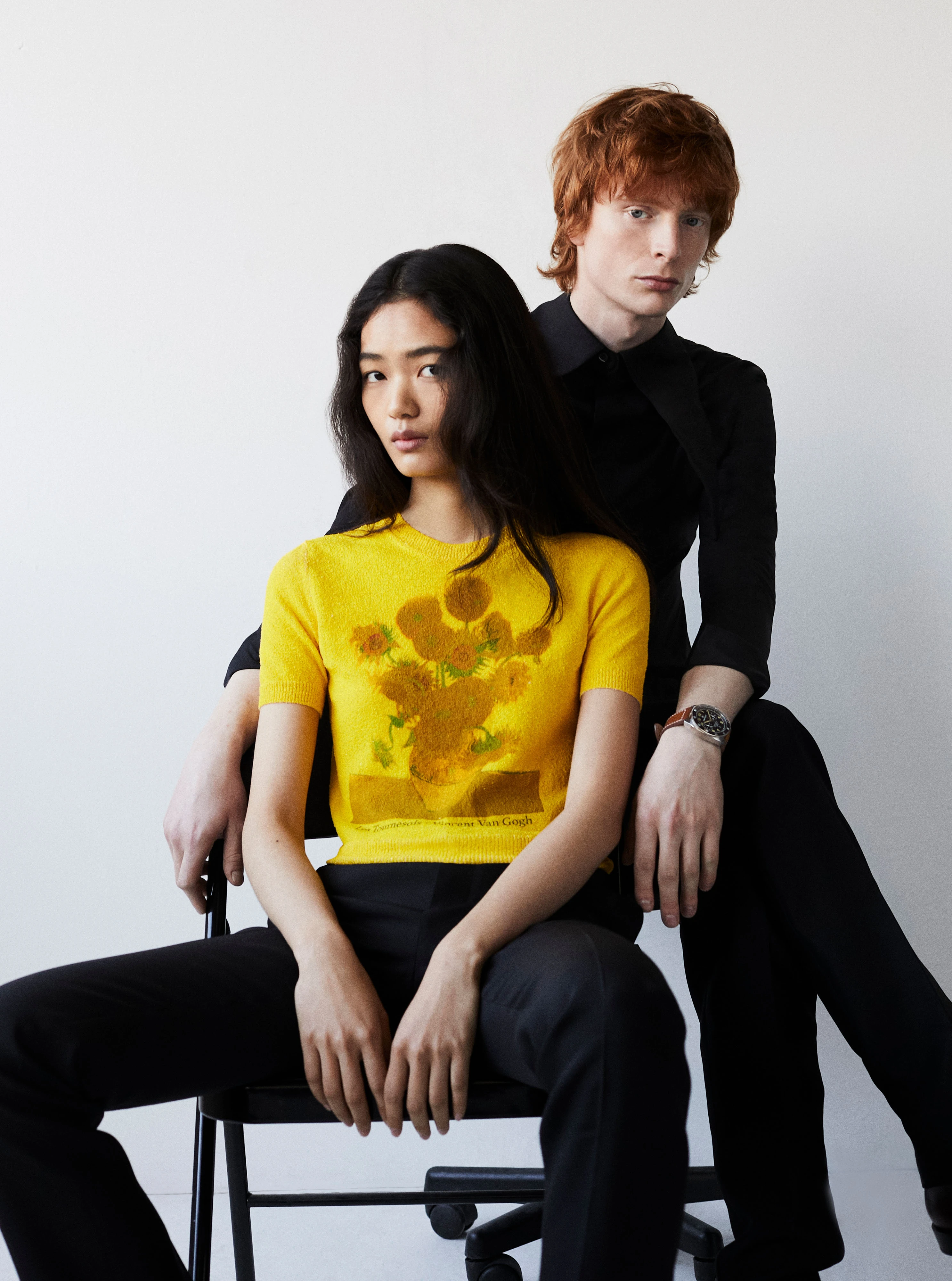 On Mason, Terra Nova watch _ Bremont, Black shirt and trousers _ Loewe; On Yuyu, Yellow cotton-blend sweater and black trousers _ Loewe