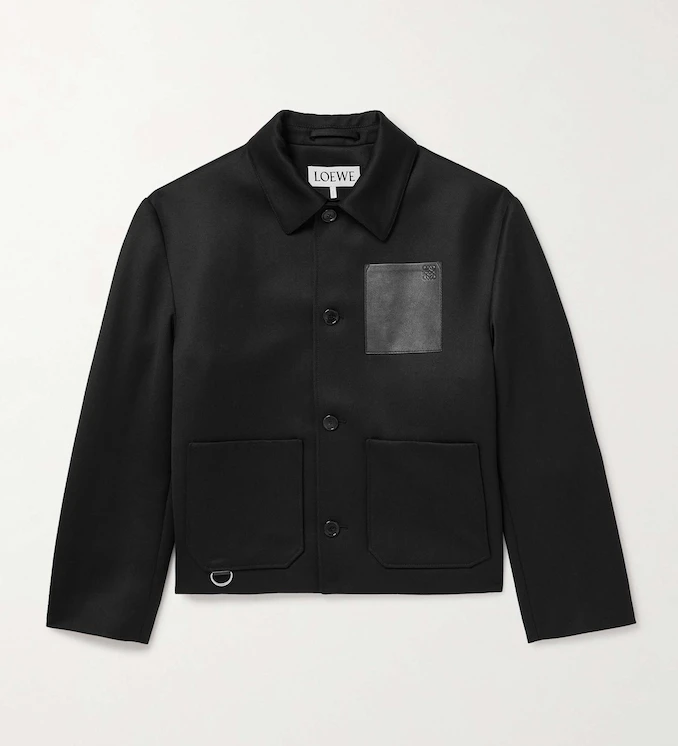 Black leather-trimmed jacket _ Loewe; Logo-print T-shirt_ Celine Homme; Beige denim jacket _ Sacai; Black cargo trousers _ Dior; Black leather sneakers _ Maison Margiela