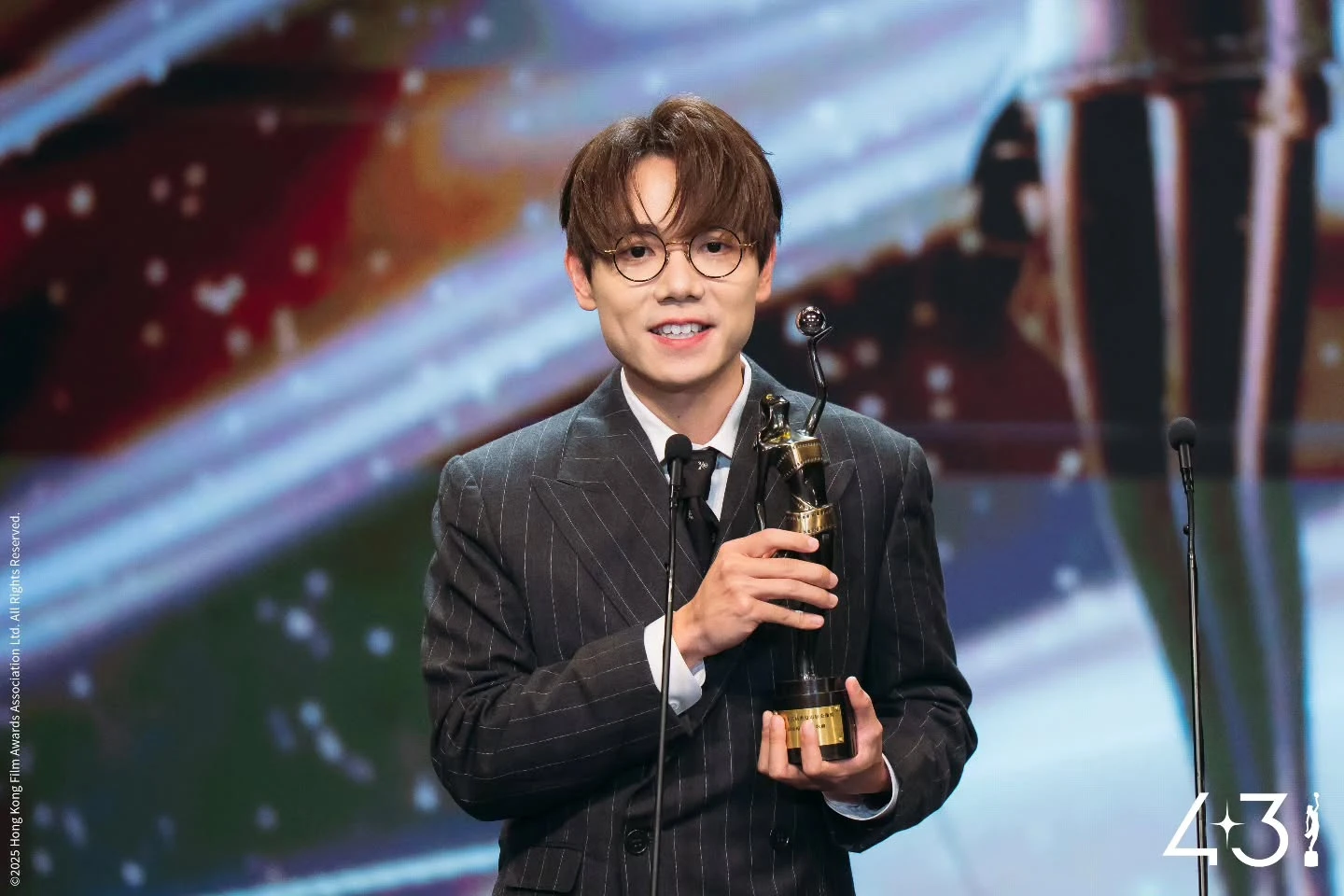Terence Lam and his Best Original Film Song award.