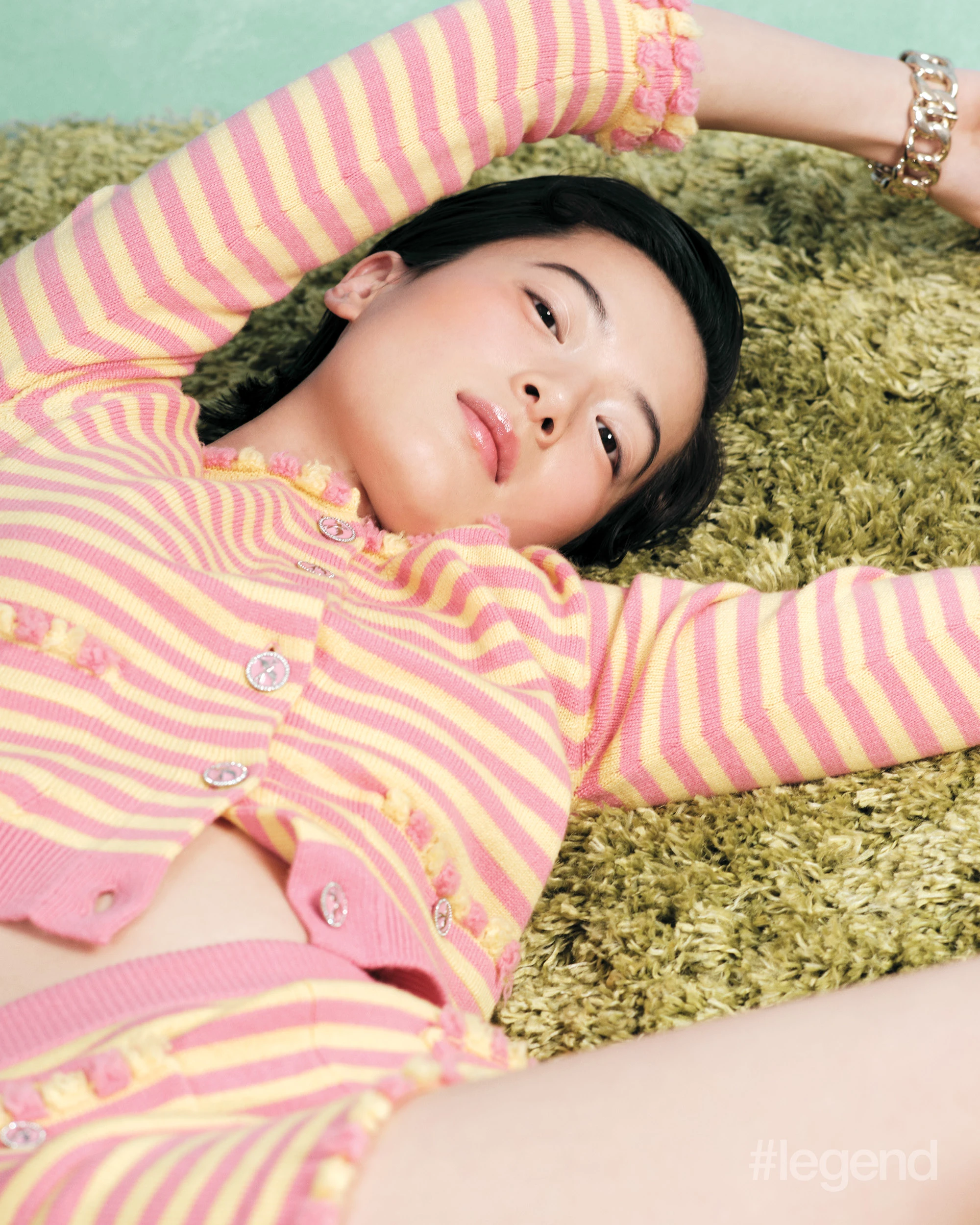 Pink and yellow striped cardigan and shorts, and silver bangles _ Chanel